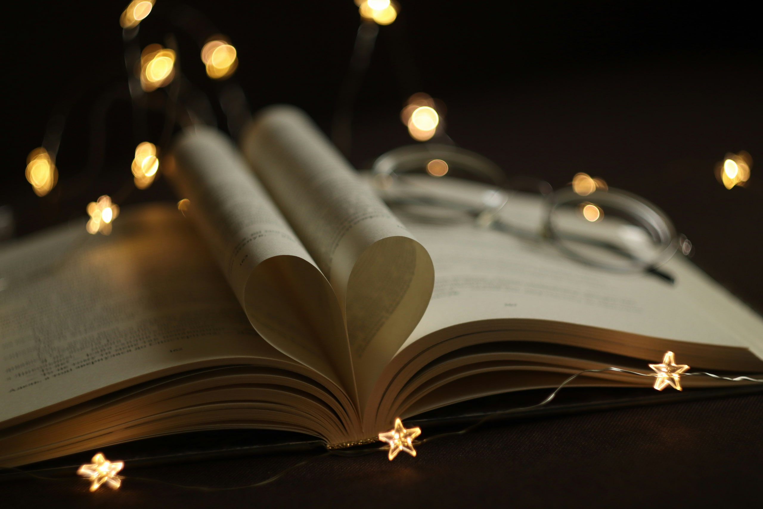 A book with pages folded in to form a heart